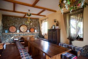 a dining room with a large wooden table and chairs at Polychko Winehouse in Vynohradiv