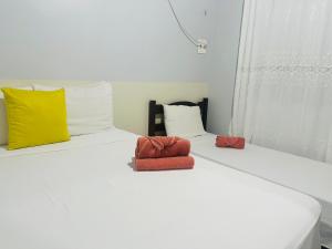 En eller flere senge i et værelse på Descanso da Preguiça, as margens do rio preguiça