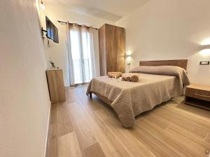 Ένα ή περισσότερα κρεβάτια σε δωμάτιο στο Da Battista Rooms