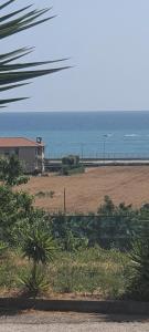 a view of a beach with the ocean in the background at Villa indipendente in Porto Potenza Picena