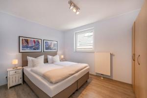 En eller flere senge i et værelse på Haus Sandkorn