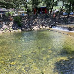 a large pool of water with a waterfall at Danyang Kotdle Moolgam Chatki Pension in Danyang +14 photos