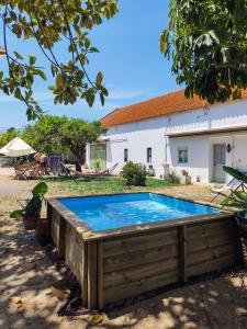 a swimming pool in the yard of a house at Montijo Garden - Guest House in Montijo