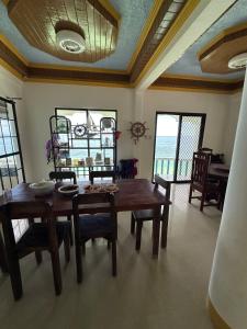 a dining room with a wooden table and chairs at Becca's Vacation House 