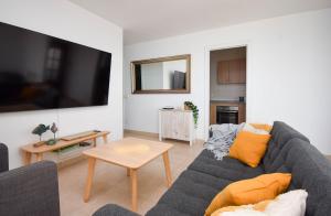 a living room with a couch and a table at Ref 200 in Las Lagunas Mijas