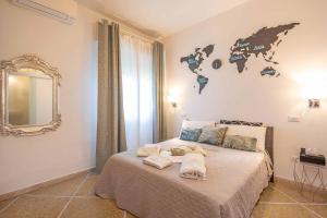 Postel nebo postele na pokoji v ubytování MIGU POINT Pisa