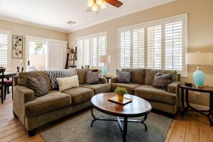 a living room with a couch and a table at Amazing Gilbert home 3 Bed 2 and half Bath sleeps 8 2 car garage in Gilbert