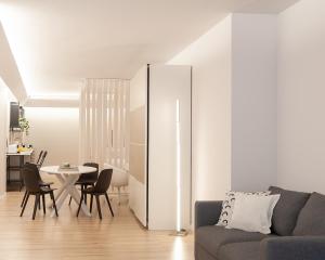 a living room with a couch and a table at Rimini Centro Loft Open Space Titan's Lair in Rimini
