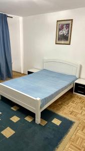 a bed in a room with a blue mattress at Jelena apart Budva in Becici