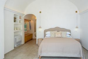 a bedroom with a large bed and a walk in closet at Casanova Suite in Positano