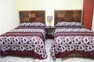 Postel nebo postele na pokoji v ubytování Hotel Topacio