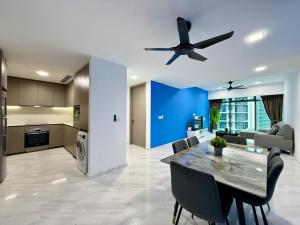 a kitchen and dining room with a ceiling fan at Eaton Residences KLCC in Kuala Lumpur