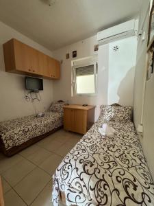 Voodi või voodid majutusasutuse Apartmani Tošić toas