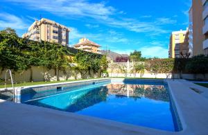 a swimming pool in the middle of a building at Ref 200 in Las Lagunas Mijas