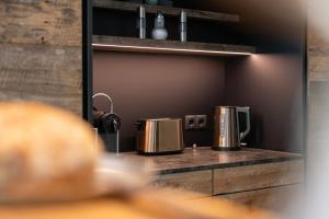 A kitchen or kitchenette at Das luxuriöse alpine Apartment in der Residenz Silvretta - Inklusive Silvretta Card Premium