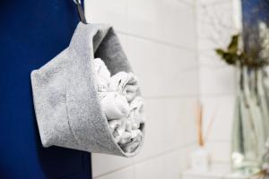 a towel hanging on a hook in a bathroom at Gartenzimmer in Atelierwohnung in Cologne