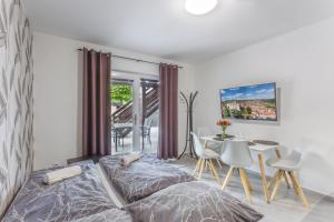 Postel nebo postele na pokoji v ubytování Apartmány pod Pálavou + 37 fotografií