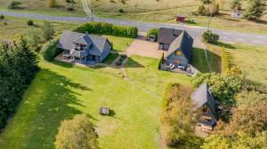 an aerial view of a house on a grass field at Huusi Holiday in Hellamaa
