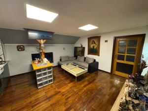 a living room with a couch and a table at Lola's Apartment in Arad