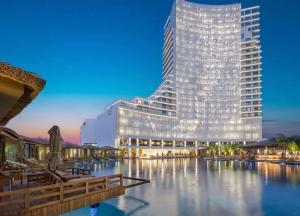 a rendering of a hotel with a large building at GRAND SAPPHIRE HOTEL CASINO and RESIDENTS 1 Bedroom Suit with Superior Sea View and Free Internet in Áyios Yeórgios