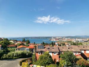 a view of a city with a river and houses at Koperinn in Koper
