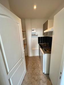 Η κουζίνα ή μικρή κουζίνα στο Beautiful apartment Bordeaux Bagatelle