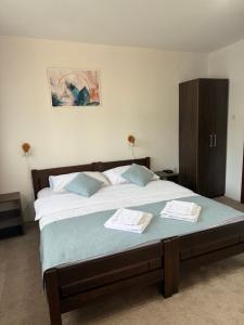 A bed or beds in a room at MB Hotel