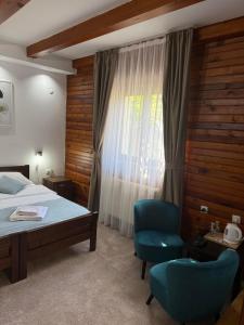 A bed or beds in a room at MB Hotel