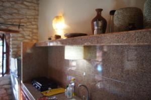 a bathroom with a sink and a counter with a lamp at Sidi Kaouki Beach Surfers Paradise in Sidi Kaouki +23 photos