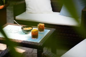 a table with two bowls of food on a bed at Hotel Berna in Eraclea Mare