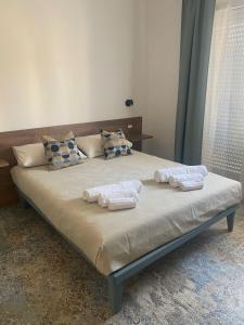 Giường trong phòng chung tại Dimora del Salento Apartment