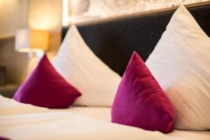Ein Bett oder Betten in einem Zimmer der Unterkunft Hotel Kirchenwirt