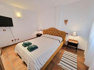 Posteľ alebo postele v izbe v ubytovaní Apartamentos Turisticos CAN CUNILL