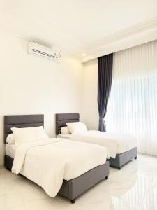 Postel nebo postele na pokoji v ubytování Panorama Sanad Resort + 28 fotografií