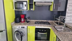 A kitchen or kitchenette at Hôtel Mandy