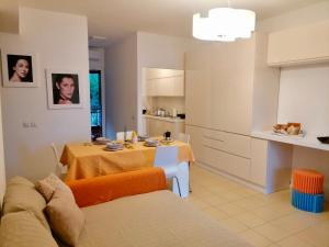 a kitchen and a living room with a dining room table at Sulla spiaggia di Letojanni in Letojanni