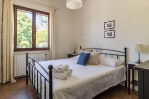 Postel nebo postele na pokoji v ubytování Villa Stefano by Garda FeWo + 63 fotografií