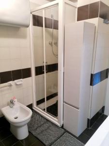 a bathroom with a shower and a toilet at Sulla spiaggia di Letojanni in Letojanni +14 photos