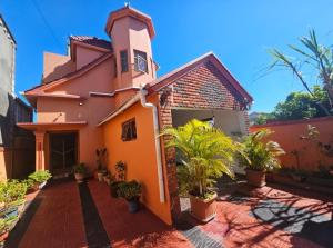 a church with plants in front of it at Island Escape Villa in Curepipe