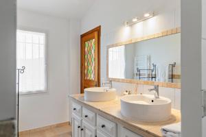 a bathroom with two sinks and a mirror at Domaine Ousta Baio in Grasse +44 photos