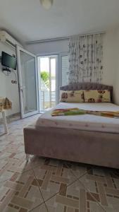 Postel nebo postele na pokoji v ubytování Villa Minaj