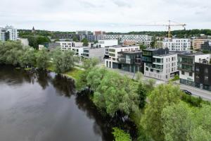 an aerial view of a city with a river at F-Apartments - Emperor Size Bed, City Center, Contactless in Tartu