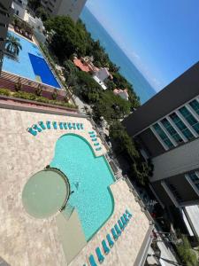 La alberca dentro o cerca de Patty del Mar Suites