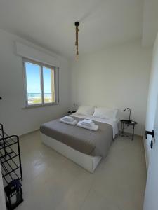 Ένα ή περισσότερα κρεβάτια σε δωμάτιο στο La Perla Saba 2