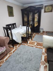 a living room with a bed and two rugs at شقة مفروشة لك وحدك قريبة من مكتبة الاسكندرية in Alexandria
