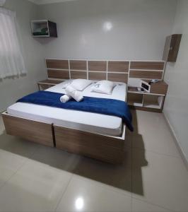 a bedroom with a bed with towels on it at M Hotel in Sao Paulo +18 photos