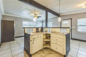 a kitchen with a counter and a ceiling fan at Amazing 'Hot Tub' Home Minutes To Hospitals & Beaches in Palmetto