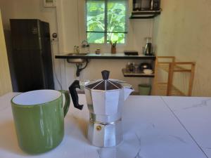 a blender sitting on a counter in a kitchen at Serenity House with Large terrace in Ban Nok +13 photos