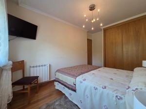 Ένα ή περισσότερα κρεβάτια σε δωμάτιο στο Apartamento Sanxenxo playa