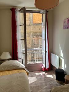 En eller flere senge i et værelse på Le bonheur partagé au Puy en Velay